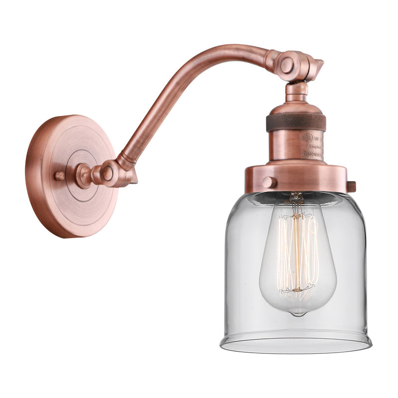 Bell Sconce shown in the Antique Copper finish with a Clear shade