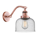 Bell Sconce shown in the Antique Copper finish with a Seedy shade