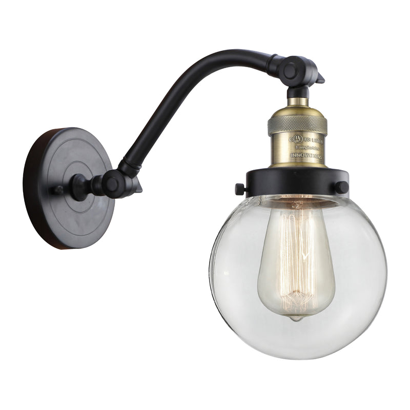 Beacon Sconce shown in the Black Antique Brass finish with a Clear shade