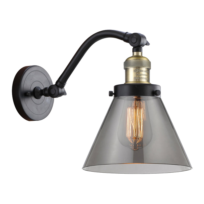 Cone Sconce shown in the Black Antique Brass finish with a Plated Smoke shade