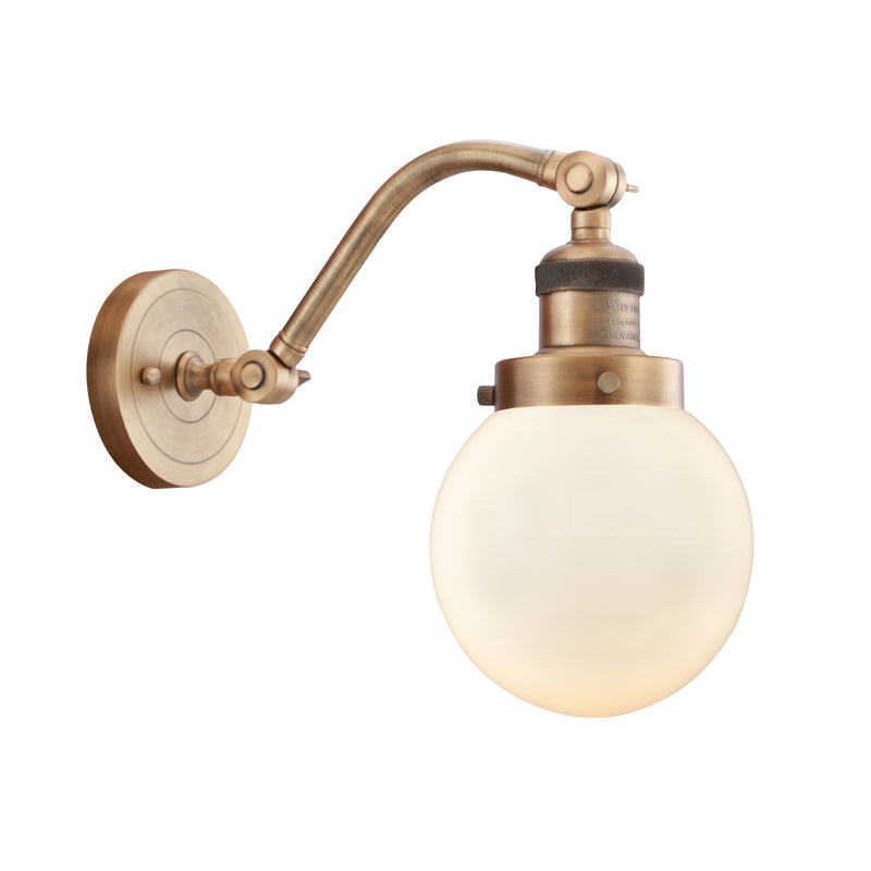 Beacon Sconce shown in the Brushed Brass finish with a Matte White shade