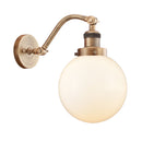 Beacon Sconce shown in the Brushed Brass finish with a Matte White shade