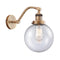 Beacon Sconce shown in the Brushed Brass finish with a Seedy shade