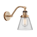 Cone Sconce shown in the Brushed Brass finish with a Clear shade