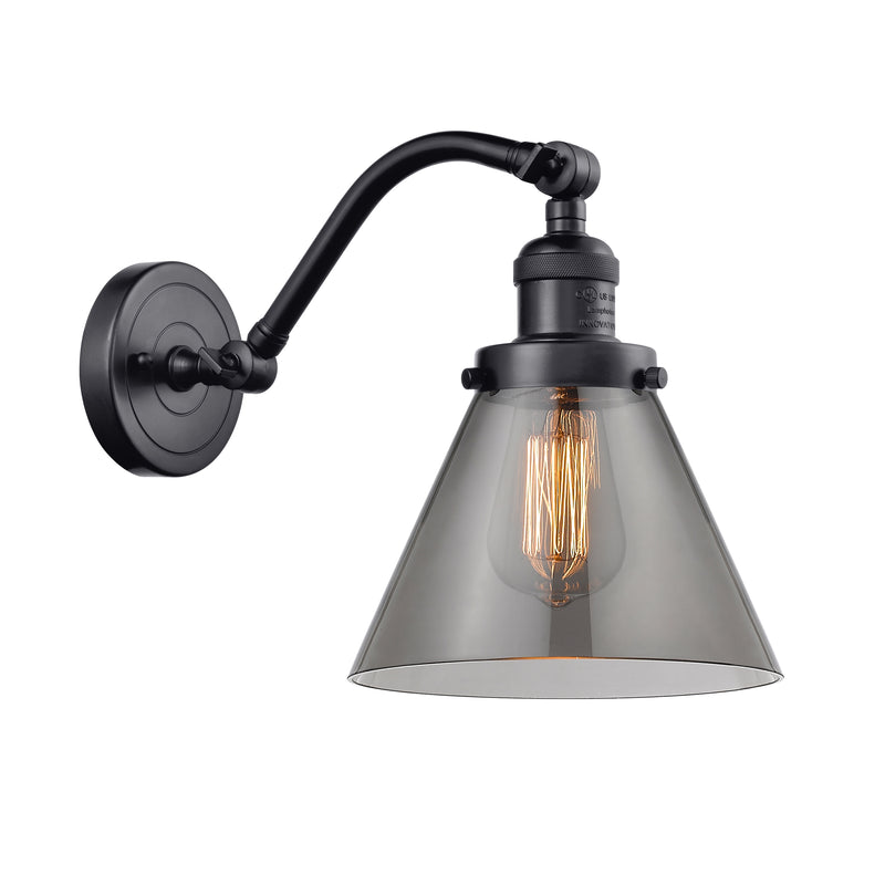 Cone Sconce shown in the Matte Black finish with a Plated Smoke shade