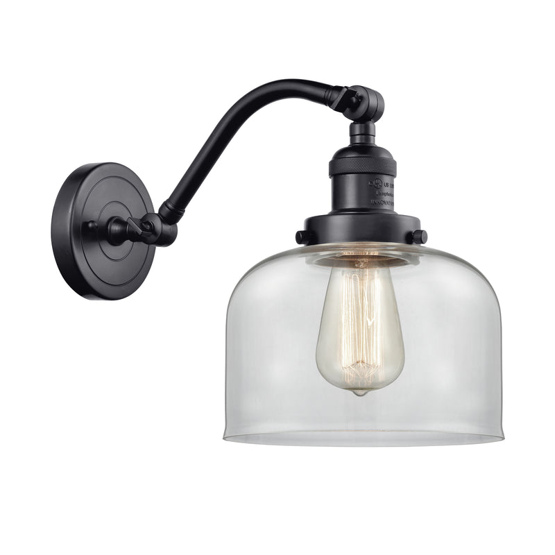 Bell Sconce shown in the Matte Black finish with a Clear shade