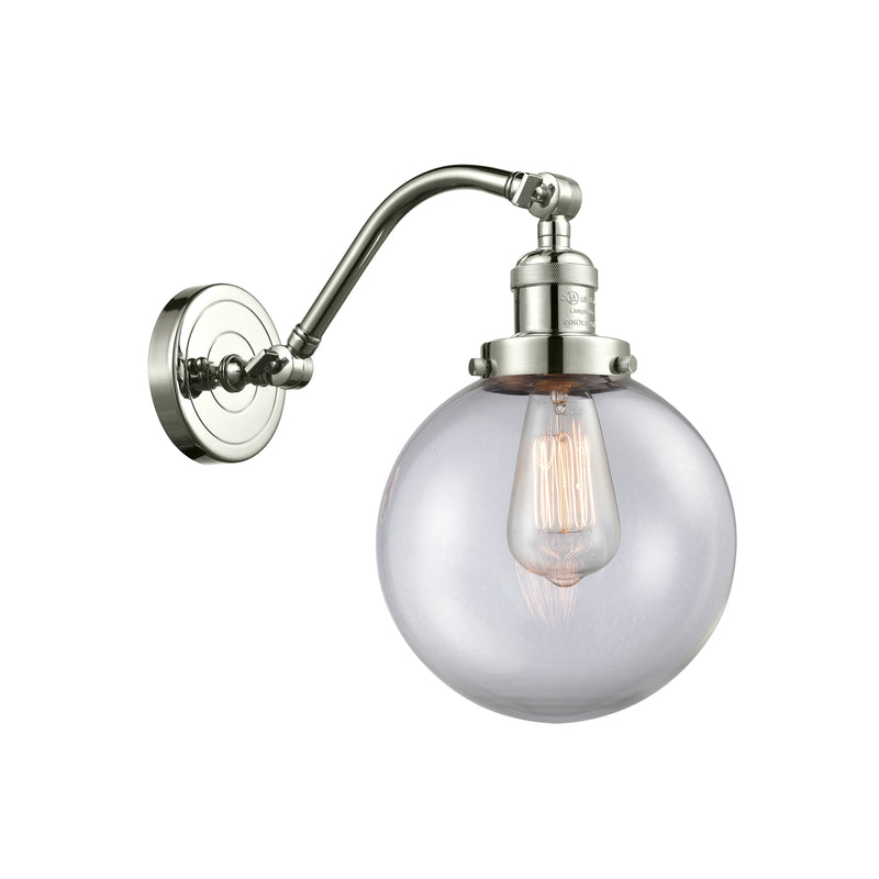 Beacon Sconce shown in the Polished Nickel finish with a Clear shade