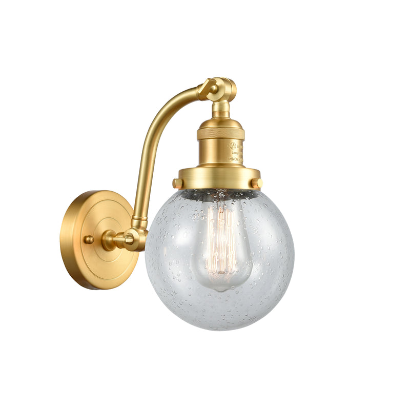 Beacon Sconce shown in the Satin Gold finish with a Seedy shade