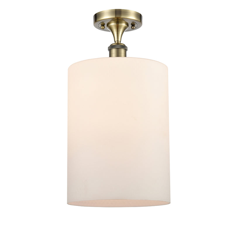 Cobbleskill Semi-Flush Mount shown in the Antique Brass finish with a Matte White shade