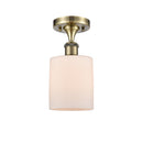 Cobbleskill Semi-Flush Mount shown in the Antique Brass finish with a Matte White shade