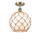 Farmhouse Rope Semi-Flush Mount shown in the Antique Brass finish with a White Glass with Brown Rope shade