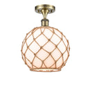 Farmhouse Rope Semi-Flush Mount shown in the Antique Brass finish with a White Glass with Brown Rope shade