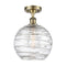 Deco Swirl Semi-Flush Mount shown in the Antique Brass finish with a Clear shade