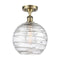 Deco Swirl Semi-Flush Mount shown in the Antique Brass finish with a Clear shade