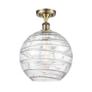 Deco Swirl Semi-Flush Mount shown in the Antique Brass finish with a Clear shade