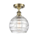 Deco Swirl Semi-Flush Mount shown in the Antique Brass finish with a Clear shade