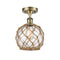 Farmhouse Rope Semi-Flush Mount shown in the Antique Brass finish with a Clear Glass with Brown Rope shade