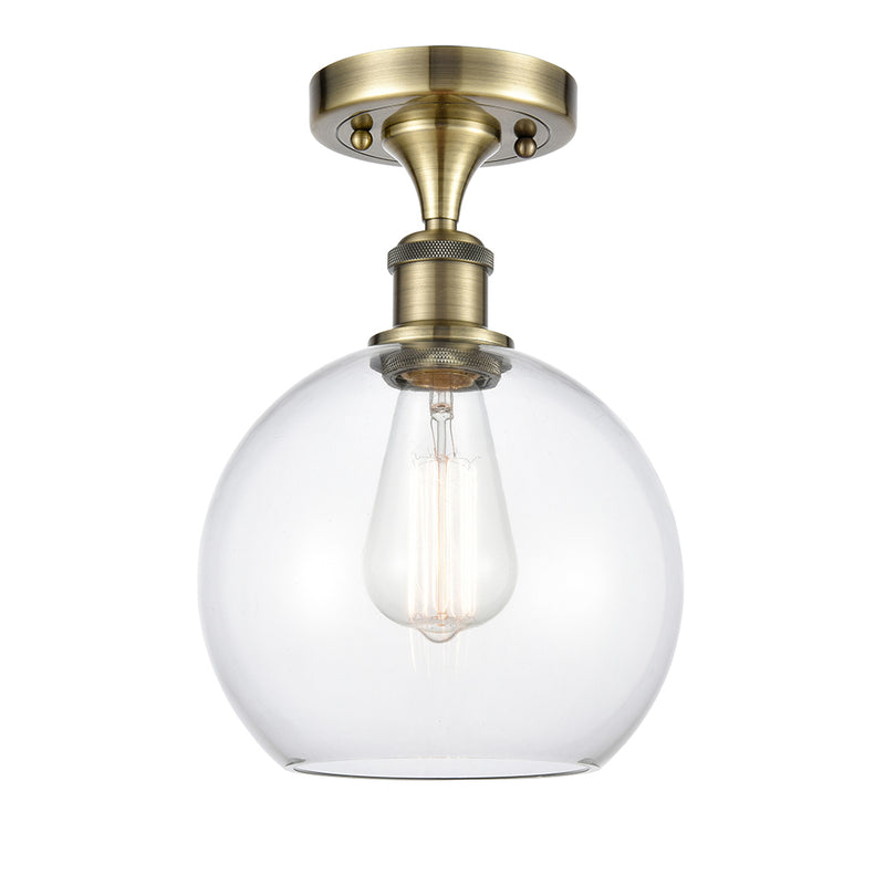 Athens Semi-Flush Mount shown in the Antique Brass finish with a Clear shade