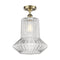 Springwater Semi-Flush Mount shown in the Antique Brass finish with a Clear Spiral Fluted shade