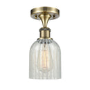 Caledonia Semi-Flush Mount shown in the Antique Brass finish with a Mouchette shade