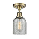 Caledonia Semi-Flush Mount shown in the Antique Brass finish with a Charcoal shade