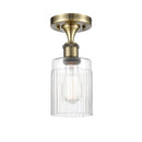Hadley Semi-Flush Mount shown in the Antique Brass finish with a Clear shade