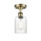 Hadley Semi-Flush Mount shown in the Antique Brass finish with a Clear shade