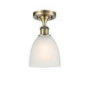 Castile Semi-Flush Mount shown in the Antique Brass finish with a White shade