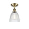 Castile Semi-Flush Mount shown in the Antique Brass finish with a Clear shade