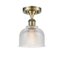 Dayton Semi-Flush Mount shown in the Antique Brass finish with a Clear shade