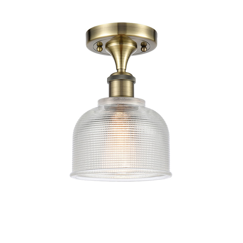 Dayton Semi-Flush Mount shown in the Antique Brass finish with a Clear shade