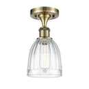 Brookfield Semi-Flush Mount shown in the Antique Brass finish with a Clear shade