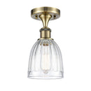 Brookfield Semi-Flush Mount shown in the Antique Brass finish with a Clear shade