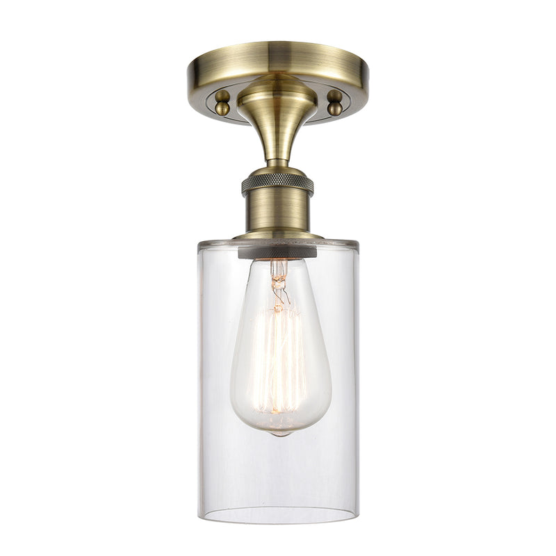 Clymer Semi-Flush Mount shown in the Antique Brass finish with a Clear shade