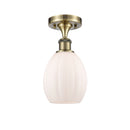 Eaton Semi-Flush Mount shown in the Antique Brass finish with a Matte White shade