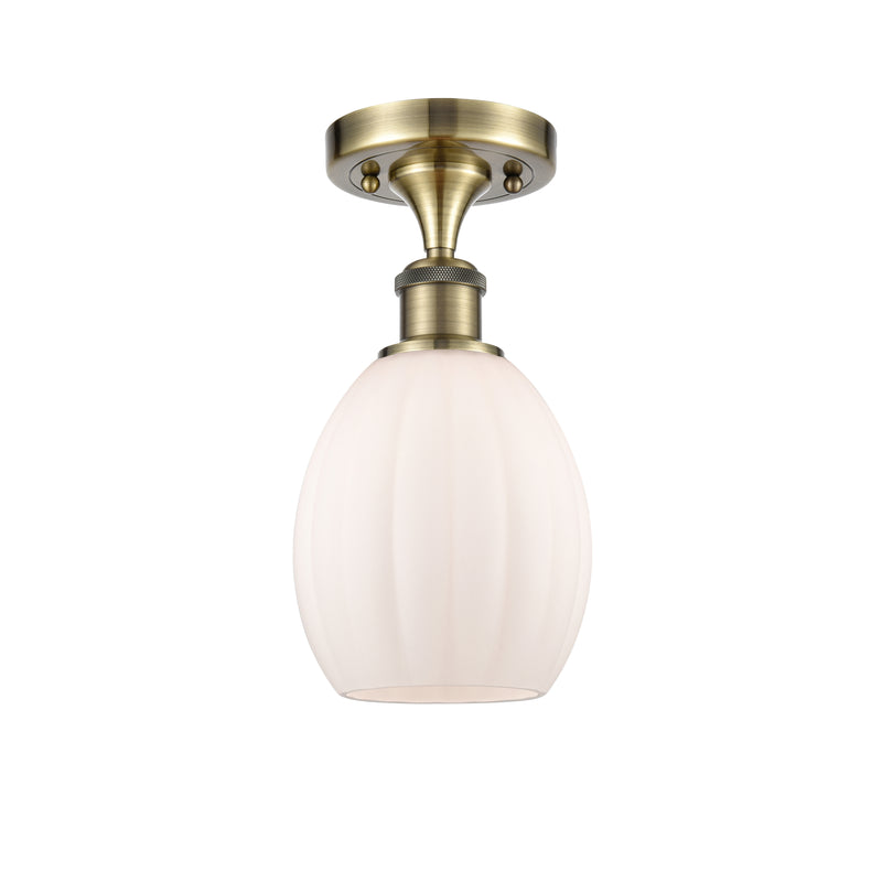 Eaton Semi-Flush Mount shown in the Antique Brass finish with a Matte White shade