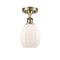 Eaton Semi-Flush Mount shown in the Antique Brass finish with a Matte White shade