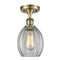 Eaton Semi-Flush Mount shown in the Antique Brass finish with a Clear shade