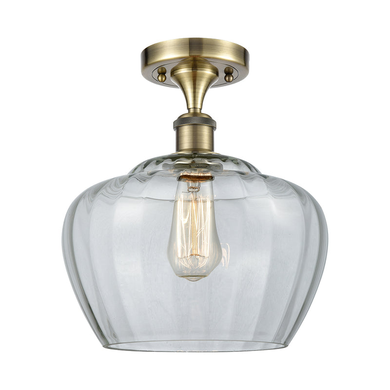 Fenton Semi-Flush Mount shown in the Antique Brass finish with a Clear shade