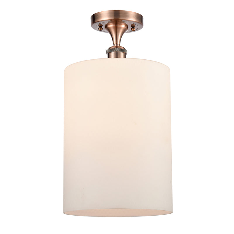 Cobbleskill Semi-Flush Mount shown in the Antique Copper finish with a Matte White shade