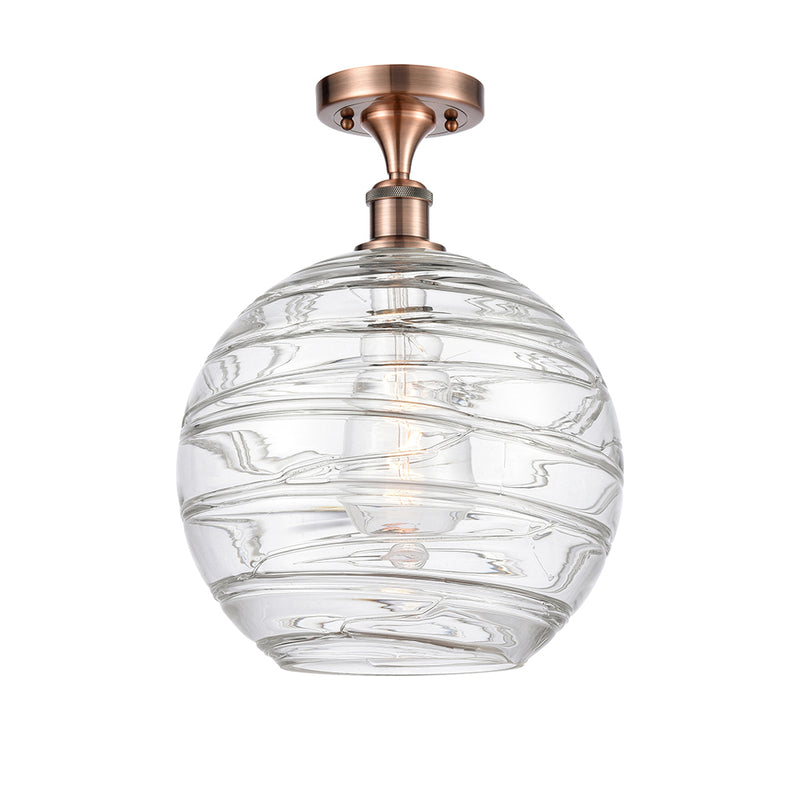 Deco Swirl Semi-Flush Mount shown in the Antique Copper finish with a Clear shade