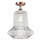 Springwater Semi-Flush Mount shown in the Antique Copper finish with a Clear Spiral Fluted shade