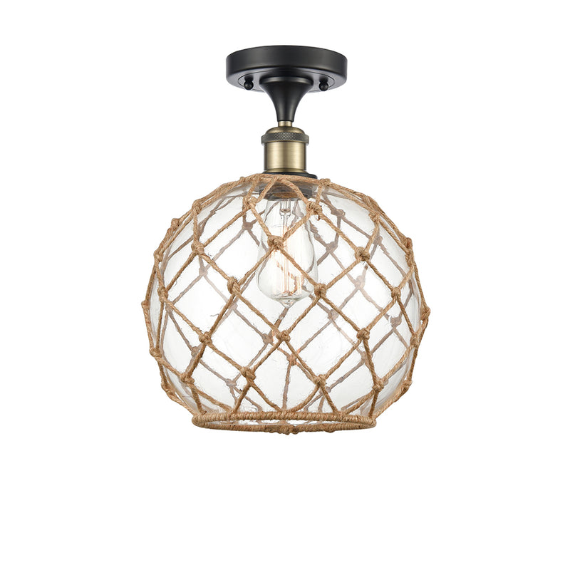 Farmhouse Rope Semi-Flush Mount shown in the Black Antique Brass finish with a Clear Glass with Brown Rope shade