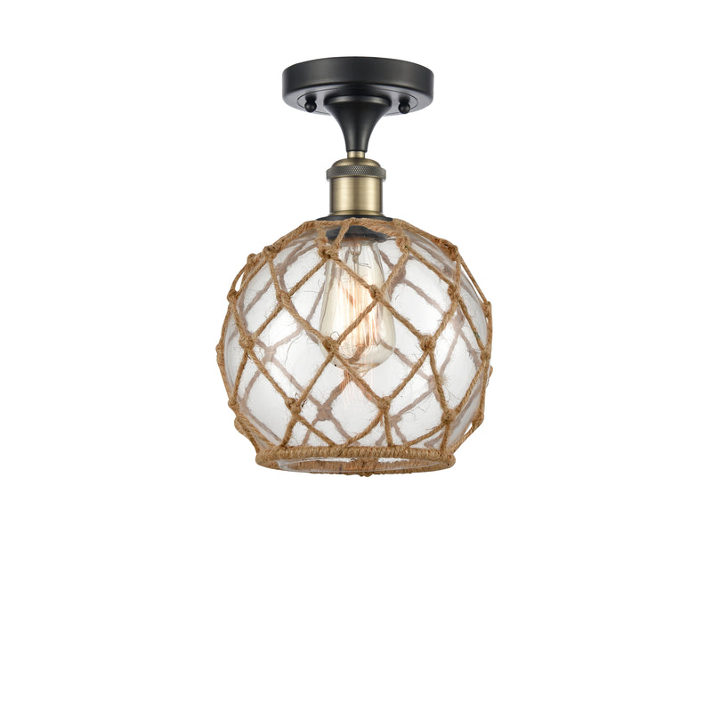 Farmhouse Rope Semi-Flush Mount shown in the Black Antique Brass finish with a Clear Glass with Brown Rope shade