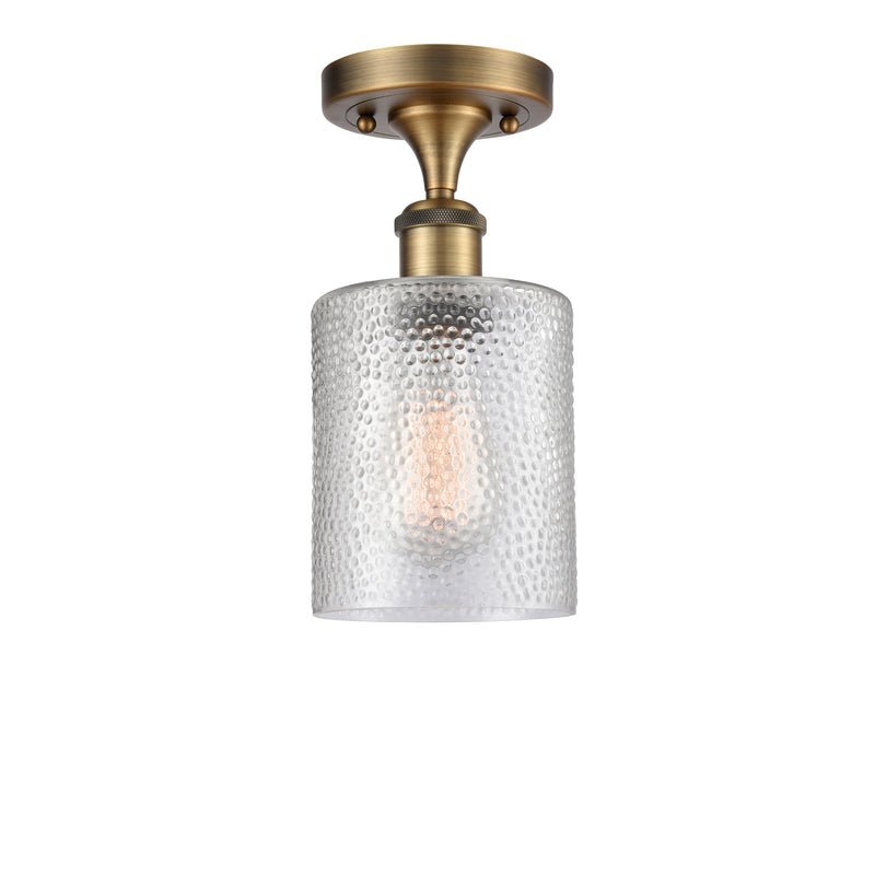 Cobbleskill Semi-Flush Mount shown in the Brushed Brass finish with a Clear shade