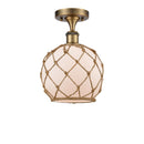 Farmhouse Rope Semi-Flush Mount shown in the Brushed Brass finish with a White Glass with Brown Rope shade