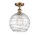 Deco Swirl Semi-Flush Mount shown in the Brushed Brass finish with a Clear shade