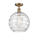 Deco Swirl Semi-Flush Mount shown in the Brushed Brass finish with a Clear shade