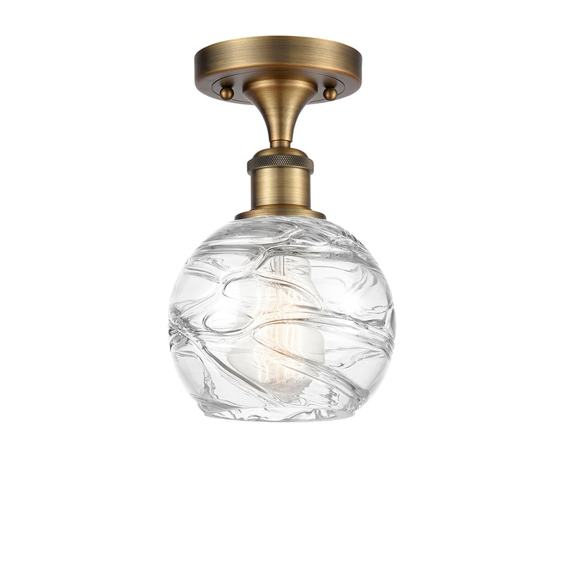 Deco Swirl Semi-Flush Mount shown in the Brushed Brass finish with a Clear shade