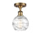 Deco Swirl Semi-Flush Mount shown in the Brushed Brass finish with a Clear shade